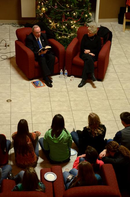 David S. Dockery, president of the university, reads the Christmas story to students gathered in the McAfee Commons. - Photo by Ebbie Davis