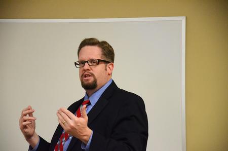 Hunter Baker, associate professor of political science, speaks on the current political situation in the United States during the Media, Politics & Democracy Town & Gown session in Providence Hall. - Photo by Zac Calvert