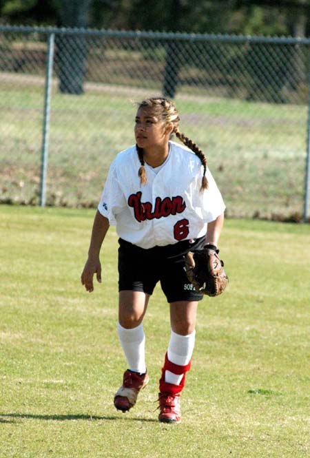 Cassandra Ramos (6) breaks toward the ball from her right field position. - Photo by Steven Aldridge