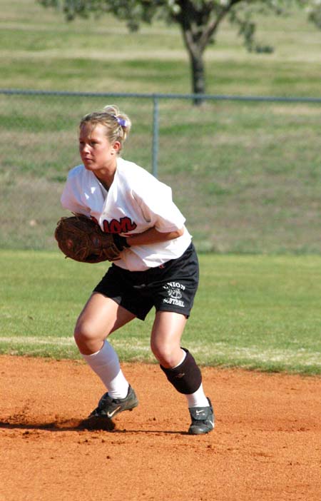 Sara Batey (7) gets in her defensive stance at second base. - Photo by Steven Aldridge