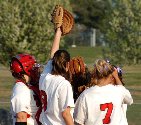 The Lady Bulldog infield comes together prior to the start of an inning. - Photo by Heidi Davis