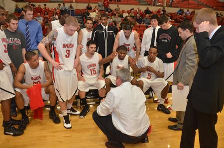 Union head coach David Niven talks with his team during a timeout. - Photo by Morris Abernathy