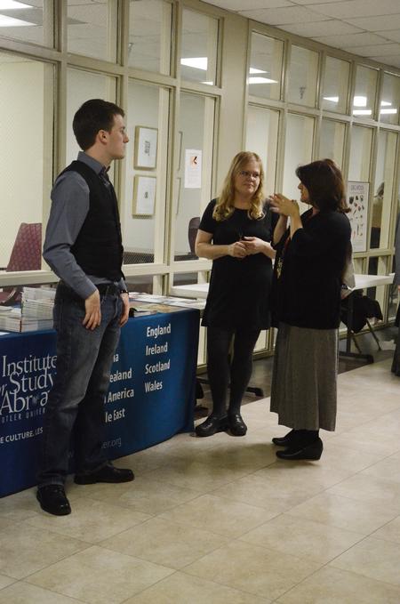 Jordan Sharp, senior applied linguistics major, talks with Opal Leeman Bartzis, field director for the Institute for Study Abroad at Butler University, and Victoria Malone, professor of language, at the external study fair. - Photo by Anne Richoux