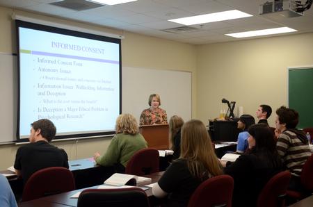 Jinni Leigh Blalack, associate professor of psychology, lectures about informed consent.  - Photo by Anne Richoux