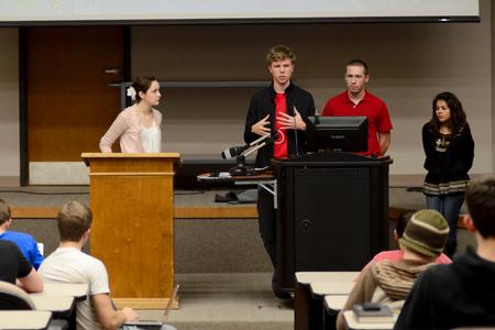 Karl Magnuson speaks about a proposed bill during a student senate meeting. - Photo by Anne Richoux