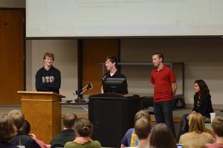 Luke Trammell (middle), sophomore political science major, talks to students about a proposed bill during a student senate meeting. - Photo by Anne Richoux