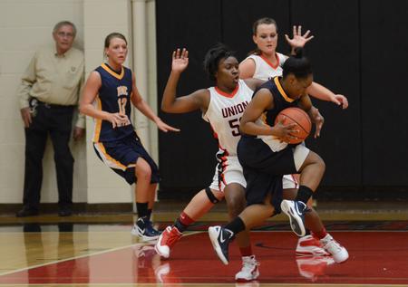 Lavanda Ross defends against 'Bam Bam' Robinson of Blue Mountain College. - Photo by Jacob Moore
