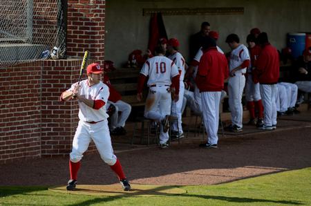 Kian Jost practices batting prior to a double-header against Taylor University. - Photo by Anne Richoux