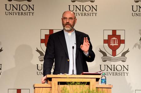 Peter Leithart, senior theology scholar at New Saint Andrews College in Moscow, Idaho, talks about Constantine initiating a revolution in Roman politics during his lecture in the Carl Grant Events Center. - Photo by Anne Richoux