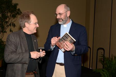 Jimmy Davis, vice president for the regional campuses, chats with Peter Leithart, senior theology scholar at New Saint Andrews College in Moscow, Idaho, following Leithart's lecture. - Photo by Anne Richoux