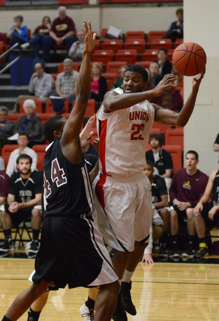 Antoine Hall looks for a pass against Freed Hardeman University's Vincent Dotson during the opening round of the TranSouth Athletic Conference Championship. - Photo by Jacob Moore