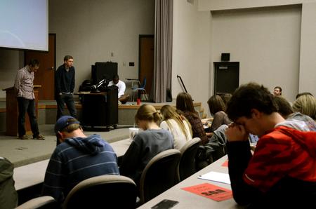 Student leaders pray at the beginning of Student Senate meeting. - Photo by Anne Richoux