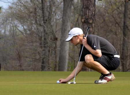 Brett Barry lines up a putt during the UT Martin/Grover Page Classic at the Jackson Country Club. 
 - Photo by Anne Richoux