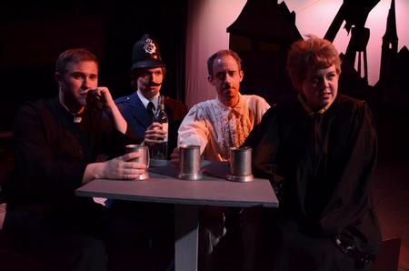 Union University Players Kevin Moss, Peter Riggs, Chad Hoy and Jillian Barron perform a scene from Friedrich Dürrenmatt's <em>The Visit</em> in the W.D. Powell Theatre. - Photo by Jacob Moore