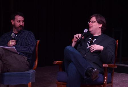 Cam Tracy, web development agent, and Chris Blair, professor of communication arts, ask questions to student directors during the first screening of the Student Film Festival. - Photo by Jacob Moore