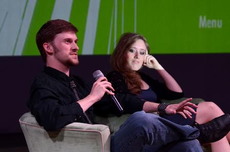 Ben Haws, junior media communications major, talks about the filming process with Beth Watson, senior media communications major, during the first screening of the Student Film Festival in the W.D. Powell Theatre. - Photo by Jacob Moore
