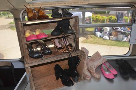 The big red bus stopped at Union University April 3 and offered Union students an opportunity to donate clothes, buy clothes that had been previously donated and interact with Chapman and other representatives from the Red Bus Project.  Students could shop for shoes, shirts, or full outfits. - Photo by Morris Abernathy