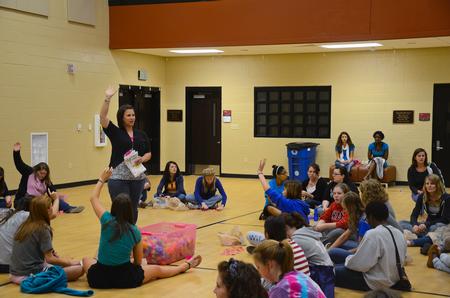 Ashley Jackson, resident director, kicks off the prize ceremony during Residence Life's Eggstravaganza event. - Photo by Zac Calvert