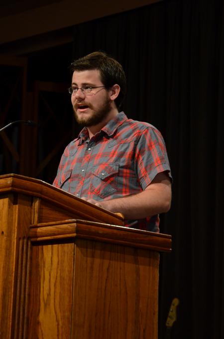 Kyle Dwyer, junior Christian studies major, speaks about his G.O. trip to Tampa during chapel.  - Photo by Anne Richoux