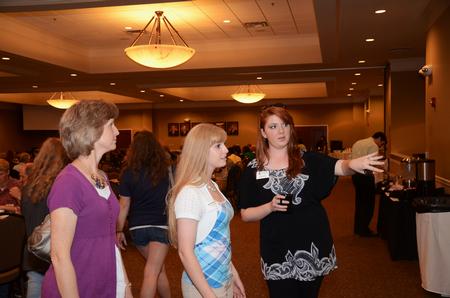 Erika King, enrollment counselor, talks with perspective student Ruth Freemon and her mother during lunch at the Carl Grant Events Center. - Photo by Zac Calvert