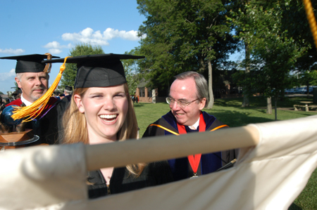 Kristin Ulmer, SGA president, followed by Union President David S. Dockery and Dr. Kelvin Moore, faculty of the year, lead the processional at spring commencement on May 22. - Photo by Jonathan Blair