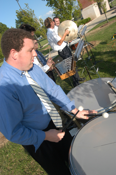 Randy Bateman plays drums with the Symphonic Band for the processional “Pomp and Circumstance” at spring commencement. - Photo by Jonathan Blair