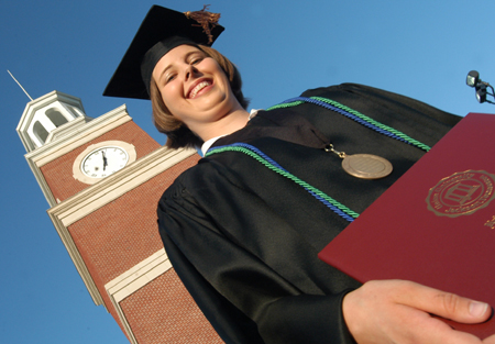 Economics/finance and Christian studies graduate Connie Cooper displays her diploma shortly after coming off the stage at spring commencement. - Photo by Jonathan Blair