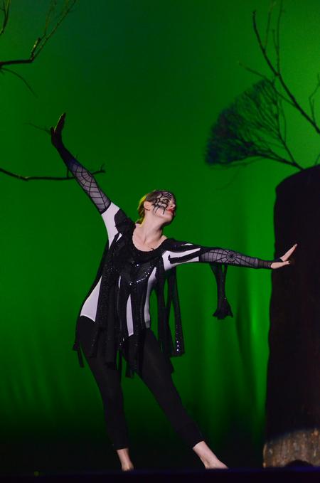 Joanna Hull, senior biology major, plays the role of a spider as part of the act by "Once Upon A Time" during the 15th Annual Variety Show. - Photo by Zac Calvert