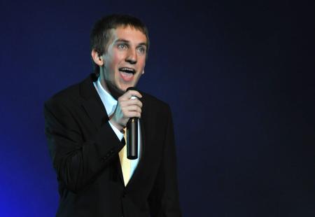 Zac McMillan, sophomore intercultural studies major, sings for the last act of the 15th Annual Variety Show while the judges finalize their votes for awards. - Photo by Morris Abernathy
