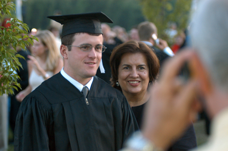 Christian ethics major Matt Glass poses for a few photos with his family after spring commencement. - Photo by Jonathan Blair