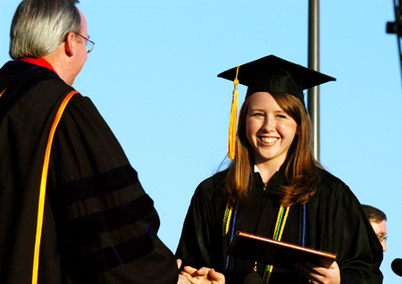 Psychology graduate Jill Baine receives her diploma from President Dockery at spring commencement. - Photo by Kristen Hiller