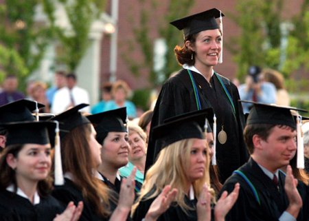 Public relations/adverstising graduate Callie Margaret Carolyn Paige Pritchett is recognized for her Academic Achievement Award at spring commencement. - Photo by Kristen Hiller