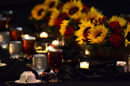 Bouquets of sunflowers and roses decorate the tables during the fourth annual Roy L. White Legacy Golf & Gala at the Carl Perkins Civic Center. - Photo by Jacob Moore