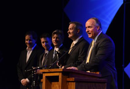 Jerry Tidwell, senior vice president for university relations, announces the winners of the golf tournament during the during the Roy L. White Legacy Golf & Gala. - Photo by Jacob Moore