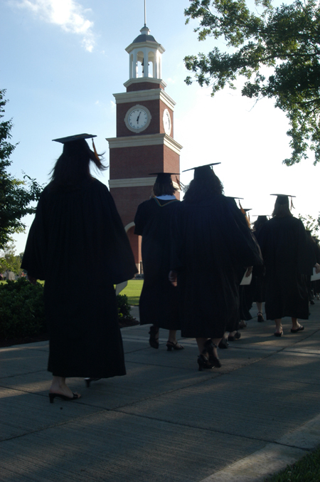 Graduates proceed toward the West Lawn for spring commencement. - Photo by Kristen Nicole Sayres