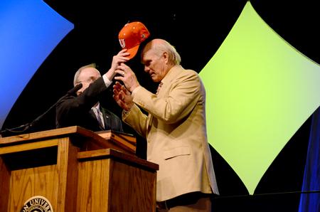 David S. Dockery, president of the university, presents keynote speaker, Terry Bradshaw, former NFL quarterback and current FOX Sports analyst with a Union baseball cap at the fourth annual Roy L. White Legacy Golf and Gala.  - Photo by Ebbie Davis