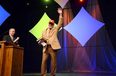 Terry Bradshaw, former NFL quarterback and current FOX Sports analyst, waves goodbye to the audience as he leaves the stage at the fourth annual Roy L. White Legacy Golf and Gala.  - Photo by Ebbie Davis