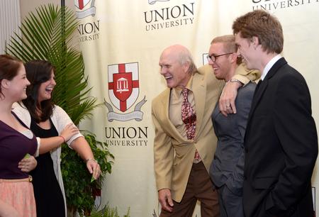 Lacey Hampton, Heather Dragg, Dodgen Swanson, and Aubrey Binkley goof off with Terry Bradshaw, former NFL quarterback and current FOX Sports analyst, after the fourth annual Roy L. White Legacy Golf and Gala.  - Photo by Ebbie Davis