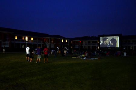 Students gather to watch Sherlock Holmes 2 for SAC's Movie on the Lawn. - Photo by Anne Richoux