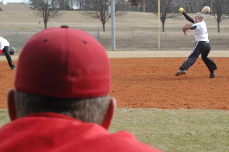 Union head coach Brian Dunn watches Mary Kosco pitch during one of Union's practices. - Photo by Lindsay Stavish