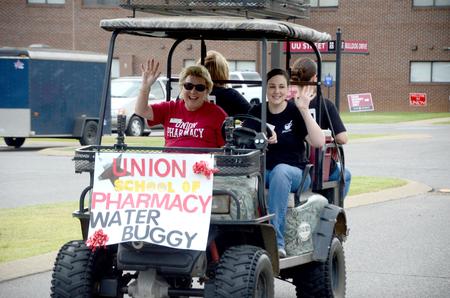 The School of Pharmacy provides water for new students, their families and volunteers during new student move-in day. - Photo by Ebbie Davis