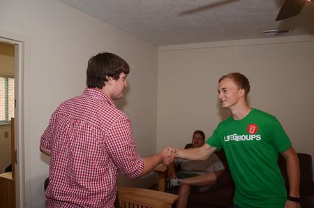 Mitch Stockdale, freshman management major, meets his LifeGroup leader Matt, sophomore mechanical engineering major, during new student move-in day. - Photo by Zac Calvert