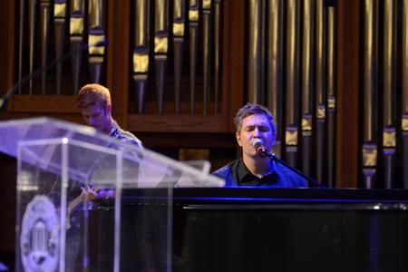 Travis Cottrell, worship pastor at Englewood Baptist Church, leads music  for new students and their families during a chapel service after new student move-in. - Photo by Jacob Moore
