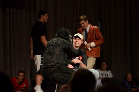 A gorilla embraces incoming freshman Dalton Lewis during a dating-game skit at the Focus show. - Photo by Jacob Moore
