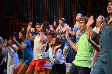 Focus leaders perform hand choreography to "Butterfly Kisses" for the incoming freshmen class and transfer students at the Focus Show. - Photo by Jacob Moore