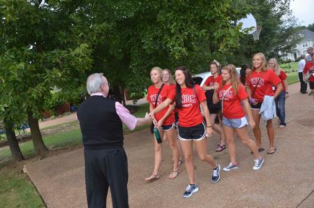 David S. Dockery, president of the university, greets new students as they arrive at his home for the annual ice cream social. Over 300 students came out for the event on the Dockery's lawn. - Photo by Morris Abernathy