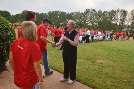 David S. Dockery, president of the university, greets each new student as they arrive at his home for the ice cream social welcoming new students. Over 300 students showed up for the event on the Dockery's lawn. - Photo by Morris Abernathy
