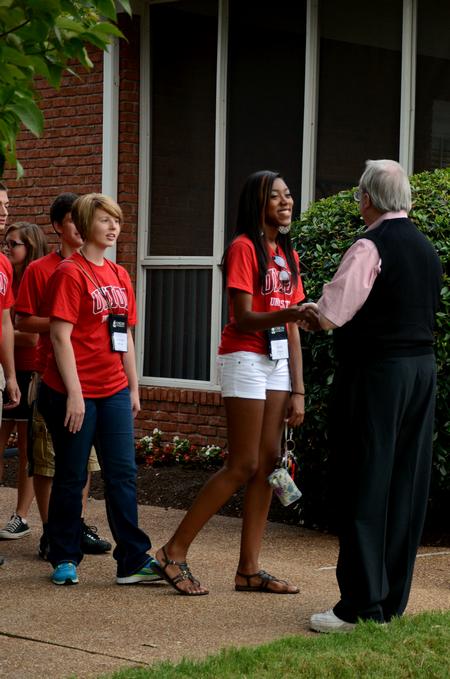 David S. Dockery, president of the university, welcomes  new students to his home for the annual ice cream social.  - Photo by Anne Richoux