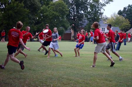 New students play ultimate frisbee during the annual ice cream social at the home of David and Lanese Dockery, president and first lady of the university.  - Photo by Anne Richoux