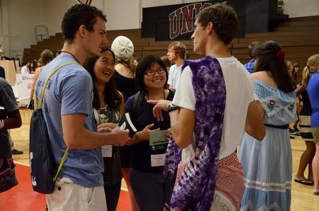 Nick Fleming (right), sophomore theatre/speech major, talks with freshmen Jon Mark Hetrick, physical education and health major, Hannah Ku, undecided major, and Cherish Lo, economics major, about LifeGroups.  - Photo by Anne Richoux